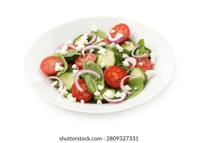 Appetizing spinach salad with cheese, walnuts and vegetables isolated on white
