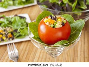 Appetizing Tomato Stuffed With Quinoa Salad And Greens