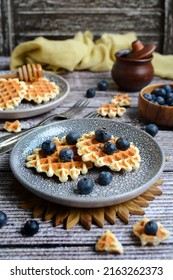 Appetizing Waffles With Blueberries And Honey On A Rustic Background. Vertical