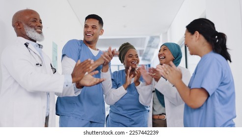 Applause, healthcare teamwork and hospital success, collaboration or motivation. Diversity, happy doctors and nurses clapping hands in commitment, trust and support of medical goals, deal or wellness - Shutterstock ID 2257442239