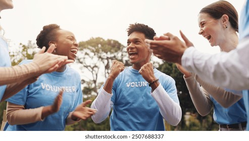 Applause, volunteer group and people in park for charity event, community service and teamwork. Volunteering, happy and men and women excited, cheer and celebrate for donation, ngo and outreach goals - Powered by Shutterstock