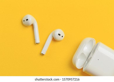 Apple AirPods - wireless bluetooth earphones or headphones and white box for storage and charging, use with Iphone, Ipad or Mac - Shutterstock ID 1570957216