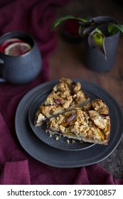 Apple Berry Crumble Pie Or Cake On Grey Plate With Cup Of Tea On Wooden Rustic Table, Homemade Cake, Dark Mood Photo, Copy Space. Baked Fruit Piece Of Dessert.