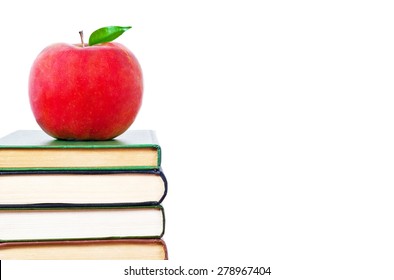 Apple And Books On A White Background