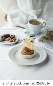 Apple Cake With Caramel Sauce Topping Served On Plate With Cup Of Coffee On The Table Side View