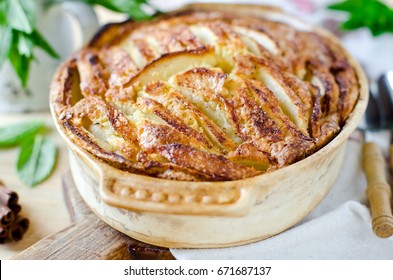 Apple cake with cinnamon on a wooden table - Powered by Shutterstock