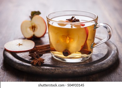 Apple Cider Drink,Juice,Cider With Spices ,Cinnamon Sticks And Fresh Apples.Hot Drink For Autumn And Winter Christmas Evenings.selective Focus.