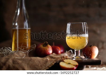 Apple cider on the rustic background