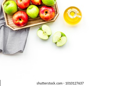 Apple Cider Vinegar In Bottle Among Fresh Apples On White Background Top View Copy Space