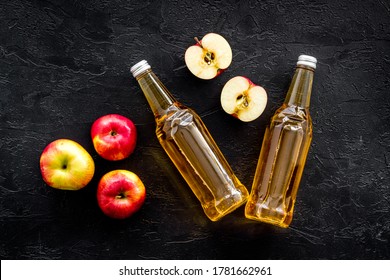 Apple Cider Vinegar Bottle On Black Background Top View