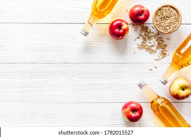 Apple Cider Vinegar Bottle On White Wooden Background Top View Copy Space