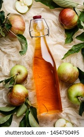 Apple cider vinegar and fresh apples, flat lay, space for your text