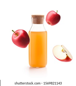 Apple cider vinegar with fresh red apples isolated on white background