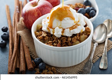 Apple Crisp With Vanilla Ice Cream With Caramel Sauce Pouring Over - Homemade Fall Dessert