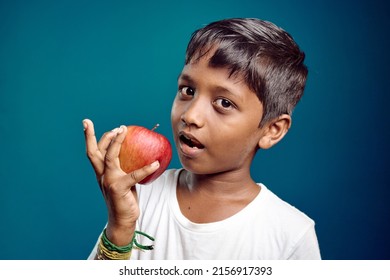 Apple Eating Asian Boy 8-10 Years Old.