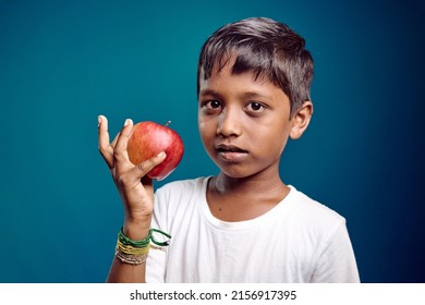 Apple Eating Asian Boy 8-10 Years Old.