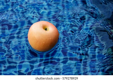 apple float in water pool with free copyspace
