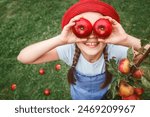 Apple Harvest for Children. Apples for Kids. Red Apple Eyes in Child.  Little Girl Having Fun in Apple Garden Orchard. 