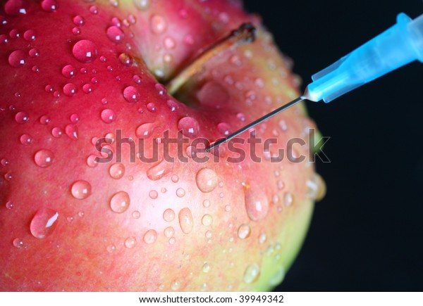 Apple injection.\
genetically modified\
foods.