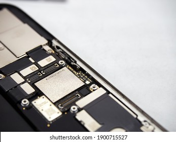 Apple iPhone 11 Pro max without display with battery, motherboard and camera modules inside hardware on a white background close up