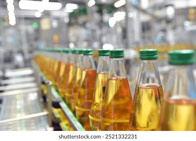 apple juice in glass bottles in a factory for the food industry - bottling and transport  - Powered by Shutterstock