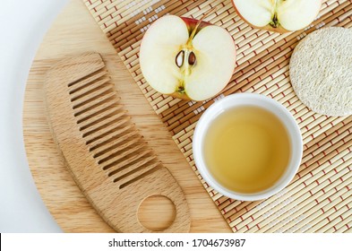 Apple Juice (vinegar) And Wooden Hair Brush. Ingredients For Preparing Homemade Hair Mask Or Face Toner. Natural Beauty Treatment Recipe And Zero Waste Concept. Top View, Copy Space. 
