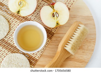 Apple Juice (vinegar) And Wooden Massage Body Brush. Ingredients For Preparing Homemade Hair Mask Or Face Toner. Natural Beauty Treatment Recipe And Zero Waste Concept. Top View, Copy Space. 