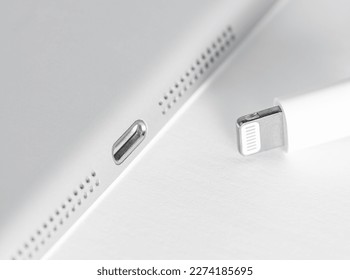 Apple Lightning Connection port on Ipad. Connection used to connect mobile devices such as iPhones, iPads or iPods to computers.