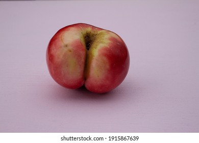 apple, love, the concept of sex, vagina, unusual apple on a pink background