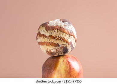 Apple With Mold And Fresh Apple On Beige Background - Mold Growth And Food Spoilage Concept