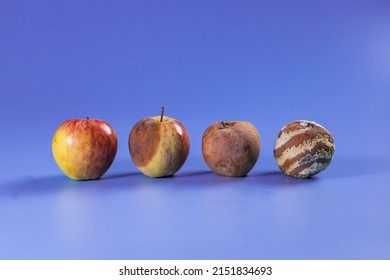 Apple With Mold And Fresh Apple On Violet Background - Mold Growth And Food Spoilage Concept