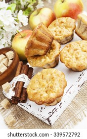 Apple muffins with cinnamon on the table - Shutterstock ID 339572792