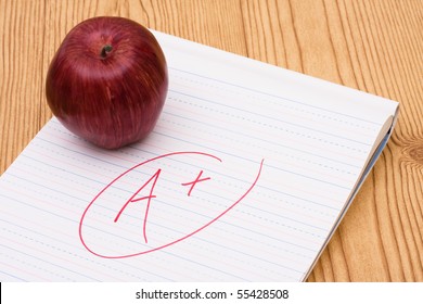 An Apple On A Piece Of Paper With A Grade On It, Good Grades