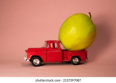 Apple On A Red Toy Truck