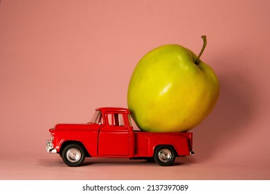 Apple On A Red Toy Truck