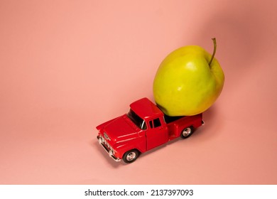 Apple On A Red Toy Truck