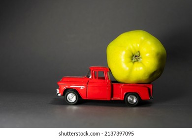 Apple On A Red Toy Truck