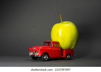 Apple On A Red Toy Truck