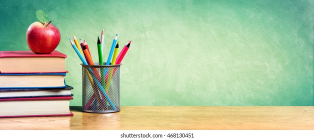 Apple On Stack Of Books With Pencils And Blank Chalkboard - Back To School
 - Powered by Shutterstock