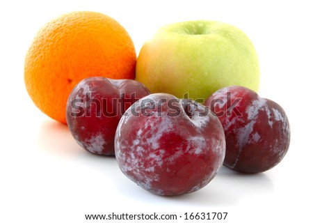 Apple, orange and  three lilac  plums on overwhite background.