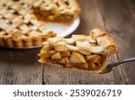 Apple Pie: A baked dessert with spiced apple filling, encased in a flaky, buttery crust, and often served warm with ice cream for a quintessentially American treat.