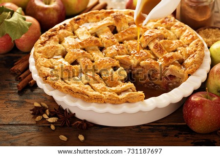 Apple pie decorated with lattice with caramel sauce, fall baking concept