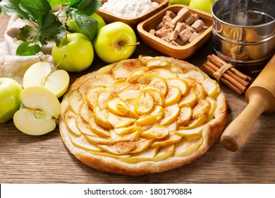 apple pie with fresh fruits on a wooden table - Powered by Shutterstock