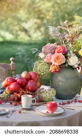 Apple Pie On Laid Table In  Garden On Sunny Day