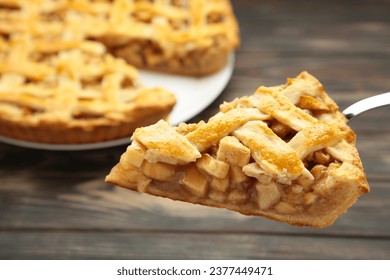 Apple pie and piece of pie on grey wooden background. Copy space. Top view - Powered by Shutterstock