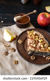 Apple Pie With Poppy Seeds And Honey Lies On A Dark Wooden Table. Homemade Cake, Desserts. Vertical Photo