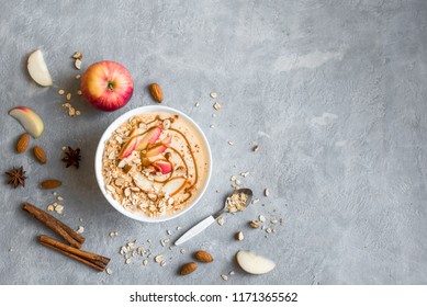 Apple Pie Smoothie Bowl. Breakfast Smoothie Bowl With Apples, Cinnamon, Almond Milk, Oat Granola And Spices, Top View.