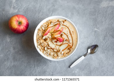 Apple Pie Smoothie Bowl. Breakfast Smoothie Bowl With Apples, Cinnamon, Almond Milk, Oat Granola, Salted Caramel And Spices, Top View, Copy Space.