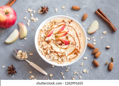 Apple Pie Smoothie Bowl. Breakfast Smoothie Bowl With Apples, Cinnamon, Almond Milk, Oat Granola, Salted Caramel And Spices, Top View, Copy Space.