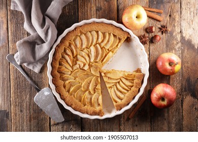 Apple Pie And Spices On Wood Background